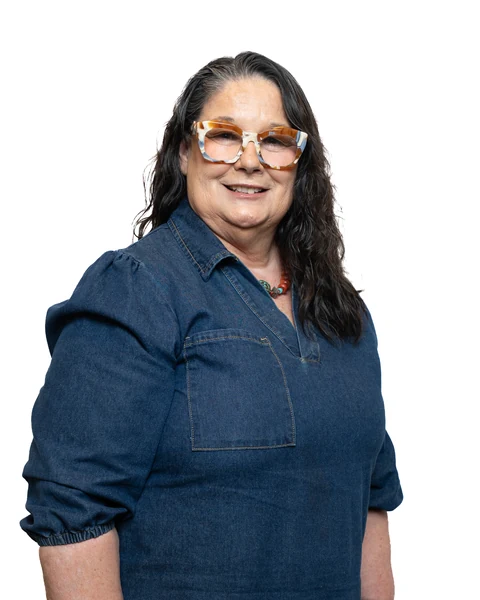Professional headshot at the Clark Insurance office opening, Magnolia, TX: woman with glasses in a denim shirt