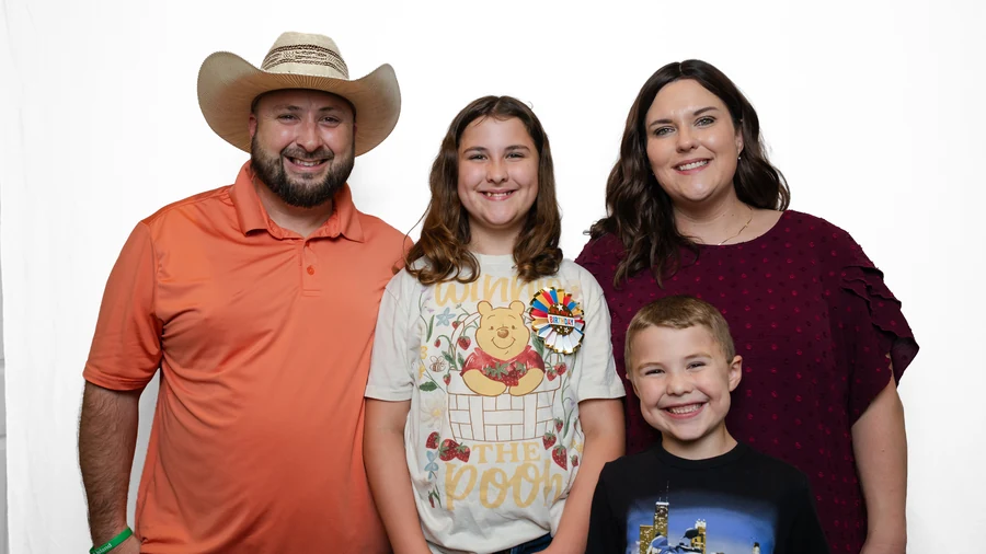 Family of four on a white backdrop